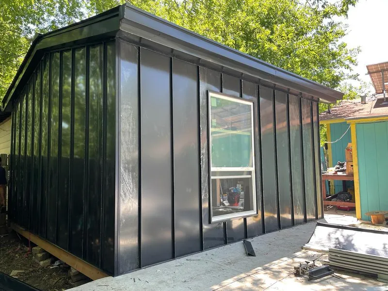 Black standing seam metal wall panels for Roof Inspection in Willard